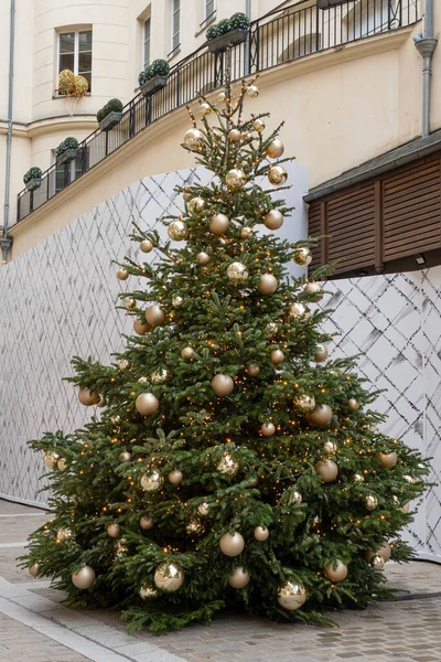 View of a chrismas tree and golden decoration outdoor