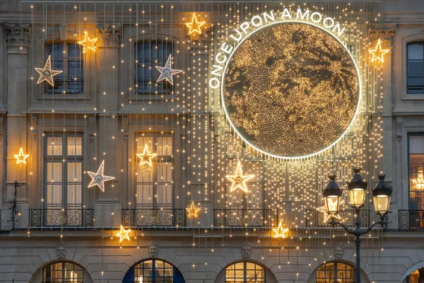 View of facade place Vendome with full moon christmas decoration