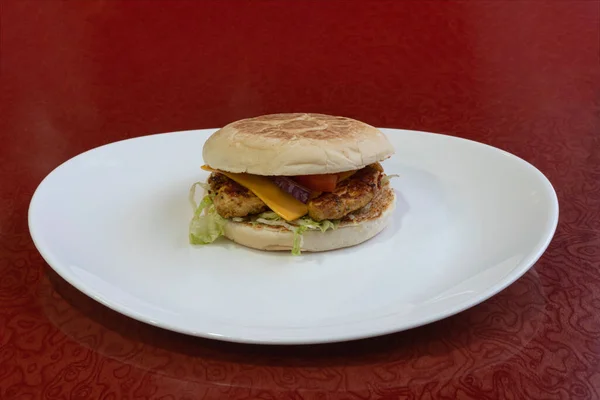 Middle East dishe culinary Still Life. Chicken fillet marinated in lemon burger with cheddar cheese and salad