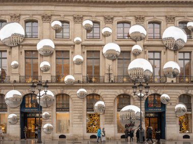 Place vendome. View of the facade of Louis Vuitton with lots of mirrors reflecting the buildings around