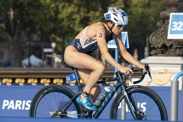 stock image Paris, France - 08 17 2023: Paris 2024 triathlon test event. Women triathletes at the cycling race on the Alexandre II bridge