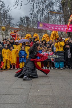 Aubervilliers, France - 02 14 2024: Chinese New Year. Festivities for the Year of the Dragon and kung fu demonstration clipart