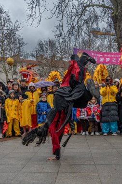 Aubervilliers, France - 02 14 2024: Chinese New Year. Festivities for the Year of the Dragon and kung fu demonstration clipart