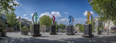 Paris, France - 05 25 2024: Olympic Games Paris 2024. View of The 4 cardinals of sport installation near Canal Saint-Martin and La Rotonde Stalingrad clipart