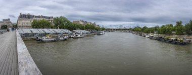 Paris, France - 07 06 2024: Olympic Games Paris 2024. View the quayside of the Seine with the estrades near the Leopold-Sedar-Senghor footbridge clipart