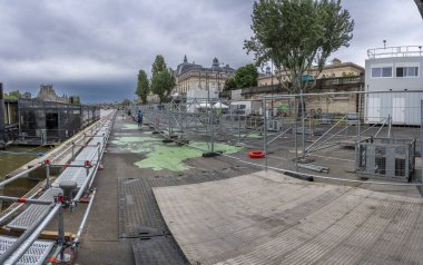 Paris, France - 07 06 2024: Olympic Games Paris 2024. View the quayside of the Seine with the estrades near the Leopold-Sedar-Senghor footbridge clipart