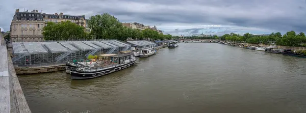 stock image Paris, France - 07 06 2024: Olympic Games Paris 2024. View the quayside of the Seine with the estrades near the Leopold-Sedar-Senghor footbridge