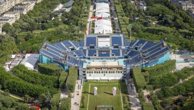 Paris, France - 07 17 2024: Olympic Games Paris 2024. View of Champ-De-Mars Arena and the Olympic site facilities for Beach Volleyball from Eiffel Tower clipart