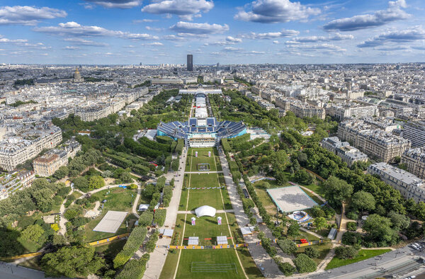 Paris, France - 07 17 2024: Olympic Games Paris 2024. View of Champ-De-Mars Arena and the Olympic site facilities for Beach Volleyball from Eiffel Tower