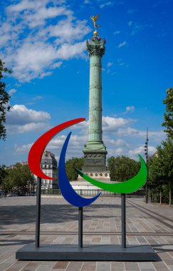 Paris, France - 07 20 2024: Olympic Games Paris 2024. View of the Bastille's Place with the July Column and the Paralympic Flames clipart