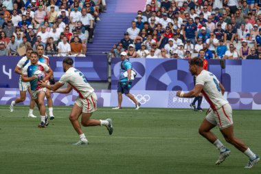 Paris, France - 07 24 2024: Olympic Games Paris 2024. View of the French rugby winner team playing in the stadium during the first day of The Olympic rugby tournament clipart