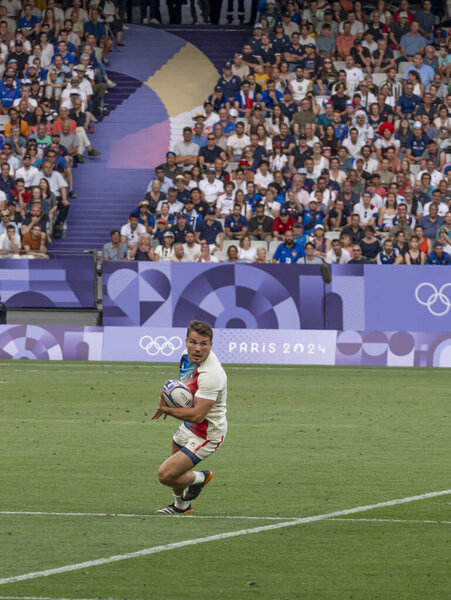 Paris, France - 07 24 2024: Olympic Games Paris 2024. View of the French rugby winner team playing in the stadium during the first day of The Olympic rugby tournament