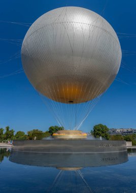 Paris, France - 08 05 2024: Olympic Games Paris 2024. View of the Olympic cauldron  on the large round Basin at Tuilerie garden clipart