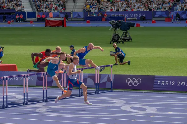 stock image Paris, France - 08 03 2024: Olympic Games Paris 2024. View of men's 110m hurdle in the stadium during preliminary round of The Olympic Athletics events