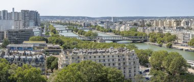 Paris, France - 08 22 2024: Eiffel Tower: Panoramic view of Swan island and brigesd of Paris from the first floor of the tower clipart