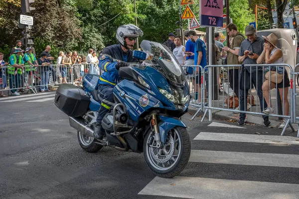 stock image Paris, France - 08 04 2024: Olympic Games Paris 2024. View of motorcycle policeman during women road cycling events