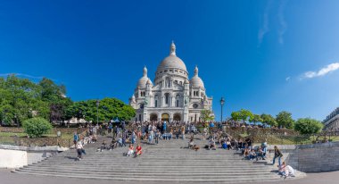 Paris, France - 07 14 2024: Montmartre district. View of the Basilica and square of sacred heart from Square Louise Miche clipart