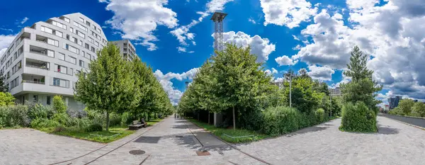 stock image Paris, France - 07 20 2024: Clichy-Batignolles Martin Luther King Park. view of the park's paths and vegetation and the buildings around