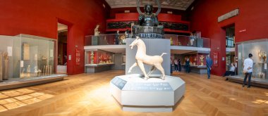 Paris, France - 07 20 2024: Cernuschi museum. Kwok Room with Equestrian art in China and the black Buddha Amida behind clipart