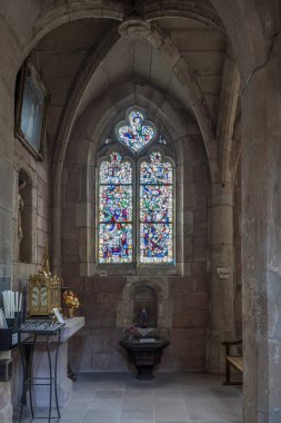 Etival-Clairefontaine, France - 09 01 2024: Saint-Pierre Abbey. view inside the Abbey of stained glass window by Jean-Jacques Gruber and Jeannette Weiss-Grubber clipart