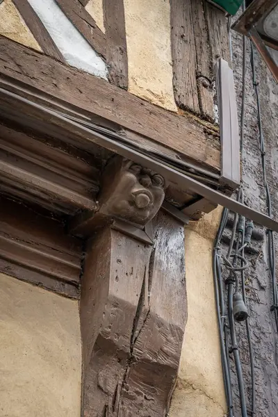 stock image Eu, France - 09 21 2024:  View the facade of a corbelled house with a projecting stone representing a head