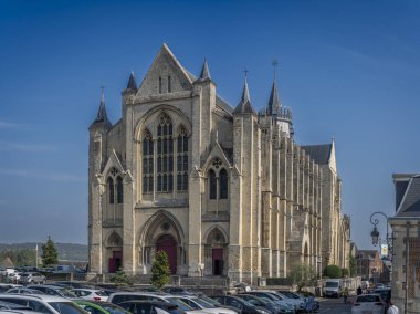 Eu, France - 09 21 2024:  View the facade of The collegiate church building clipart