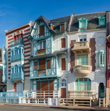 Mers-Les-Bains, France - 09 16 2024: View of a typical colorful villa of vertical seaside architecture clipart