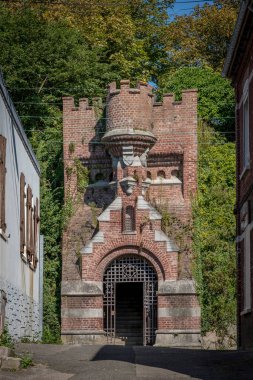 Ault, France - 09 15 2024:  View of the Moulinet Gate from Saint-Pierre Street clipart