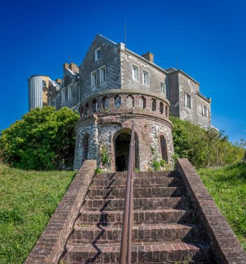 Ault, France - 09 15 2024:  View the Moulinet Castle from the staircase of the Moulinet Gate clipart