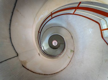 Ault, France - 09 15 2024: view of the spiral staircase inside the Lighthouse clipart