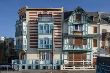 Mers-Les-Bains, France - 09 14 2024: View of typical colorful villas clipart