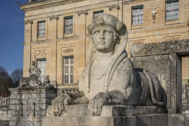 Maincy, France - 11 29 2024: Le Grand Noel. View details of statues of the facade of Vaux-le-Vicomte Castle on its stone staircase clipart