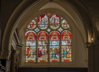 Provins, France - 09 01 2024: Saint-Ayoul church. View inside the church of the new stained glass windows clipart