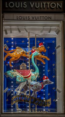 Paris, France - 12 11 2024: Place vendome. View of the facade of Louis Vuitton with christmas decoration by night clipart