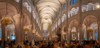 Paris, France - 12 16 2024: Notre Dame de Paris. Panoramic view of the arches, stained glass window of the nave and side aisle inside the Cathedral clipart