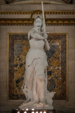 Paris, France - 12 18 2024: View detail of Joan of Arc statue inside Madeleine church clipart