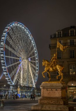 Paris, France - 12 18 2024: View the ferris wheel merry-go-round of Tuileries garden, The Golden Statue of Joan of Arc and Rivoli Street clipart