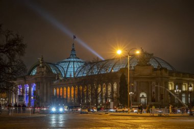 Paris, France - 12 18 2024: View of Le Grand-Palais and Avenue des Champs Elysees with Christmas lights by night clipart