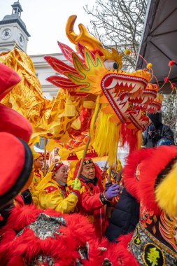 Aubervilliers, France - 02 05 2022: Chinese New Year. Year of the wood snake. Official guests perform dragon painting ceremony clipart