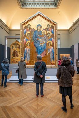 Paris, France - 03 01 2025: Cimabue, The Origins of Italian Painting. The Virgin Mary and The Christ Child Enthroned Surrounded by Six Angels, tempera and gold on panel clipart