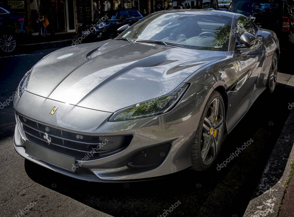 Deauville, France - 09 01 2023: View of a gray new Ferrari car parked in town