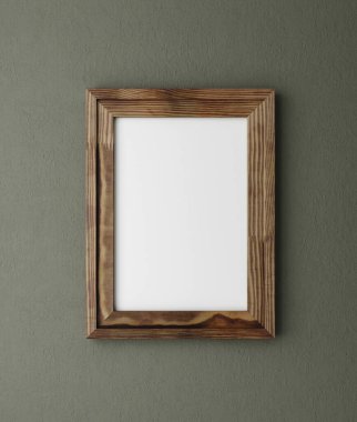 A4 kağıt boyutunda poster çerçeve modeli. Duvara yakın. Koyu yeşil renk, eski ahşap çerçeve.