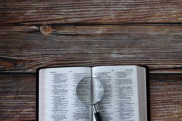Holy Bible Book Magnifying Glass Wooden Background Copy Space Top — Stock Photo, Image