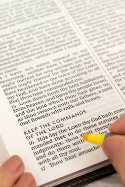 Commandments of the LORD text in open holy bible book. Christian wisdom, obedience and faith in God Jesus Christ, biblical concept.