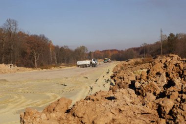 Preparatory construction work for the construction of a new asphalt road. 