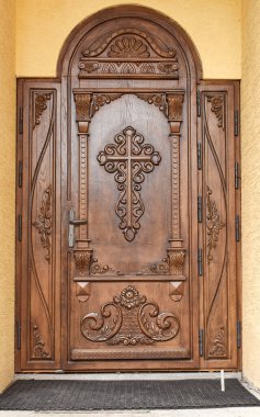 Wooden door with a ross.