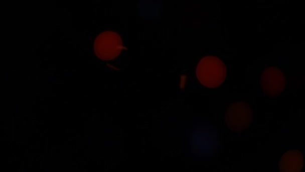 Blinkendes Bokeh Orange Und Rot Schwarzer Hintergrund — Stockvideo