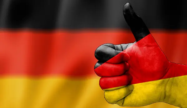 Alman bayrağıyla onaylanmış bir el. Almanca bayrak arkaplan alanı bulanık olan resim, alanı kopyala