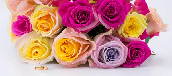 Multi colored roses bouquet on white background Flowers representing love