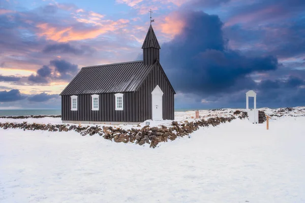 The little black church of Budir, Black Church. South coast of Snaefellsnes peninsula In the West of Winter Iceland.